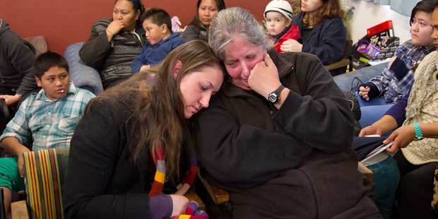Parents Alicia Krueger (L) and Jackie Kissel react after being told by Phillipstown principal Tony Simpson their the school will be merged. Photo / Martin Hunter