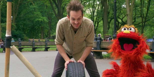 Kiwi Joseph Herscher makes a plant-watering machine out of a car tyre on Sesame Street. Photo / Supplied