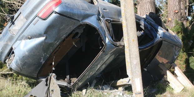 The crash scene after a car hit a power pole on Kahutara Road, between Featherston and Martinborough. Photo / Lynda Feringa/Wairarapa Times Age