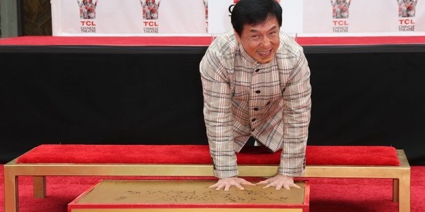 Actor Jackie Chan makes hand imprints at the TCL Chinese Theatre. Photo / AFP