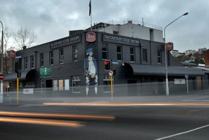 Lights from passing cars are captured outside Dunedin's Captain Cook Tavern, which is facing closure this month. Photo / ODT