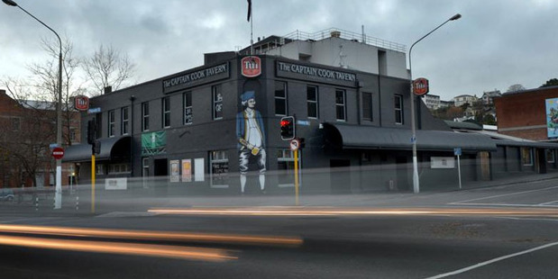 Lights from passing cars are captured outside Dunedin's Captain Cook Tavern, which is facing closure this month. Photo / ODT
