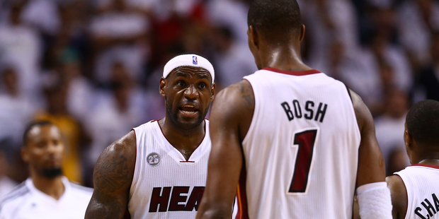 LeBron James #6 talks to Chris Bosh #1 of the Miami Heat. Photo / Getty Images.