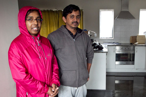 Simna Nair and Sajeev Puthussery spent the night with friends after water flowed through their rented house in Don Buck Drive, soaking their bed, the sofa and the carpets. Photo / Natalie Slade
