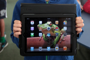 Max Sutton is happy with his tablet computer. Photo / Doug Sherring
