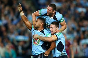 Michael Jennings of the Blues celebrates scoring a try. Photo / Getty Images