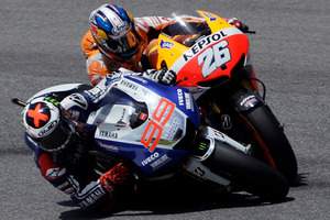 Spain's Jorge Lorenzo, left, overtakes second placed compatriot Dani Pedrosa on his way to win the Italian Moto GP, at the Mugello race circuit, in Scarperia, Italy. Photo / AP