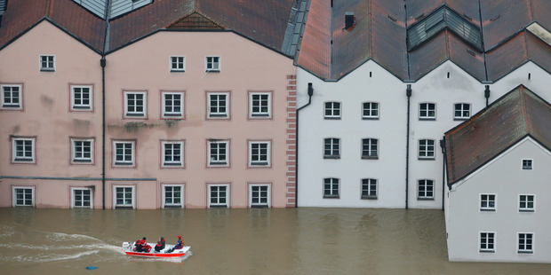 The Red Cross in Passau, Germany, negotiate flooded streets in boats. Photo / AP