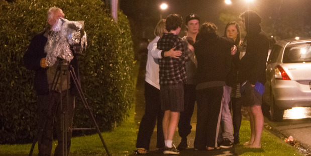 People gather at the scene of a fatal stabbing in Campbell Street, Havelock North on Friday night. Photo / Glenn Taylor