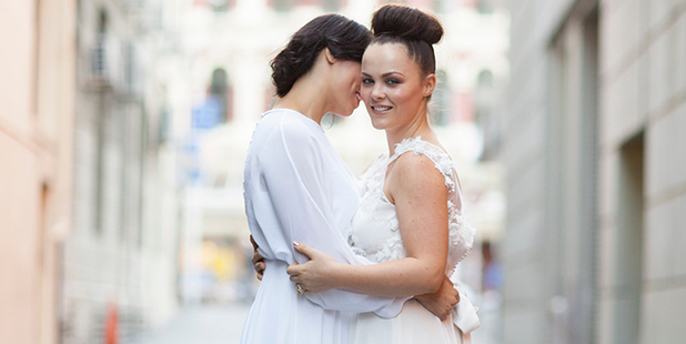 Fiancees Sasha Kljakovic and Taryn Kerr are the faces of what Sera Lilly believes to be NZ's first same-sex bridal campaign. Photo / Poppymoss Photography