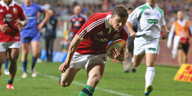 Brian O'Driscoll, the Lions captain, races clear to score the second try. Photo / Getty Images
