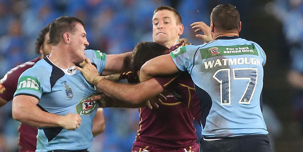 Paul Gallen of the Blues punches Nate Myles of the Maroons during State of Origin I. Photo / Getty Images