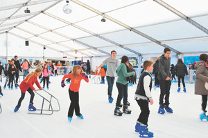 Skaters at the temporary ice skating rink set up by Auckland Council in Aotea square.