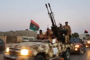 Various army special forces trucks arrive at the scene after fighting broke out. Photo / AP