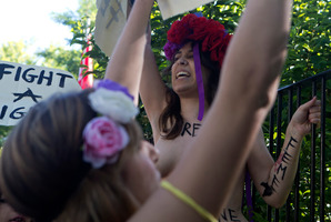 Activists of FEMEN shout for the release of fellow activists, who are imprisoned in Tunisia during a protest outside the Tunisian embassy in Madrid. Photo / AP
