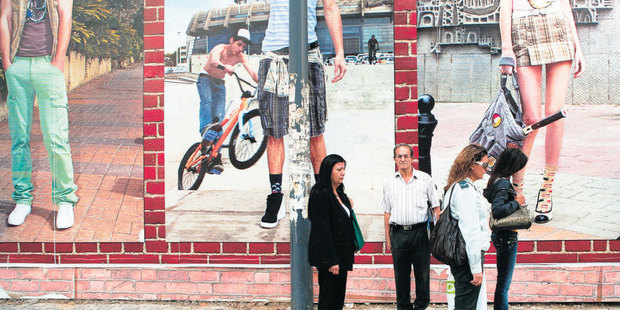 Israelis stand still as a siren marking Holocaust Remembrance Day sounds in Tel Aviv. Photo / AP