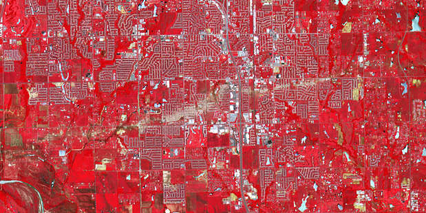 The path of the tornado is seen as a beige line across Moore. Photo/NASA