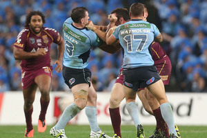 Paul Gallen of the Blues punches Nate Myles of the Maroons. Photo / Getty Images
