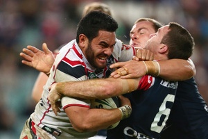 Konrad Hurrel makes a determined charge against the Roosters on Sunday. Photo / Getty Images