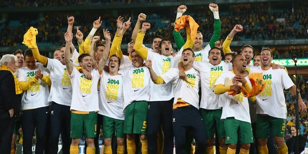 The Australian soccer team celebrate after qualifying for the 2014 FIFA World Cup. Photo / Getty Images