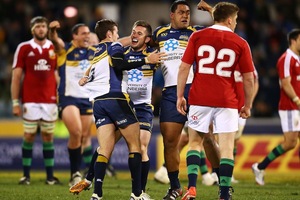 Members of the Brumbies squad celebrate a historic win over the Lions. Photo / Getty images