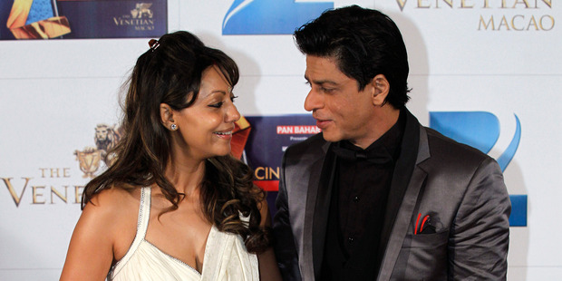 Shah Rukh Khan and his wife Gauri are being investigated over claims they know the sex of their unborn baby. Photo / AP