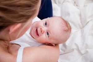 The book says eye contact is vital and urges parents to describe out loud what their baby is doing. Photo / Getty Images