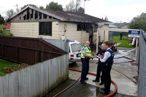 A body was found in a bedroom of the gutted Hamilton home. Photo / Christine Cornege