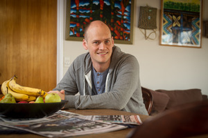 Sam Snedden relishes a conversation around the dining table. Photo / Michael Craig