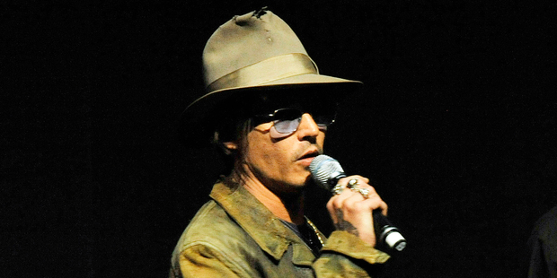 Johnny Depp frequently wears tinted glasses to correct his vision. Photo / AP