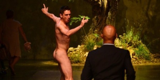 A streaker is chased by a security guard at the end of Dolce & Gabbana show.Photo / AFP