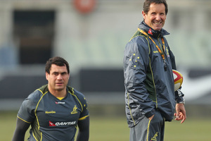 Wallabies coach Robbie Deans looks on as George Smith of the Wallabies stretches during an Australian Wallabies training session. Photo / Getty Images.