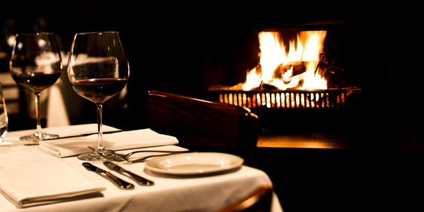 Andiamo's restaurant dining by the fire in Herne Bay. Photo / Babiche Martens