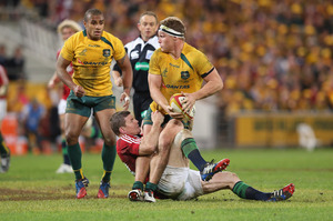 Michael Hooper of the Wallabies is tackled by Brian O'Driscoll. Photo / Getty Images