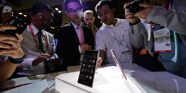 Richard Yu, chairman of Huawei Device, speaks during the launch of Huawei Technologies Co.'s new range of Ascend D quad mobile phones. Photo / AFP