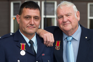 Royal Humane Society of NZ braveryaward recipients, Station Officer Brett Delamere, left, and Rural Fire Officer Eric Spittal after receiving their medals. Photo / Mark Mitchell