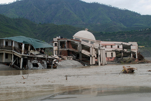A damaged government guest house falls into the flooded water of the River Ganges in Shrinagar district, in the northern Indian state of Uttarakhand, India. Photo / AP