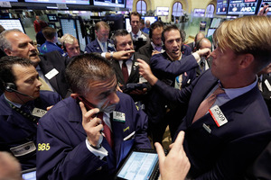 US traders have dumped stocks, bonds and commodities, prompted by signs of distress in China's economy. Photo / AP