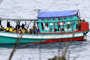 A secretly-filmed video has shed new light on how people smugglers ply their trade. This boat load of Vietnamese boat people arrived on Christmas Island in April this year. Photo / AP