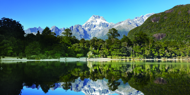 Mt Madeline is reflected in the water of Lake Alabaster.