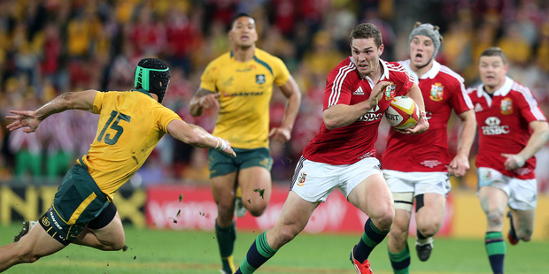 Lions winger George North steps round Berrick Barnes on his way to scoring his wonder try at Suncorp Stadium last week. Photo / Getty Images