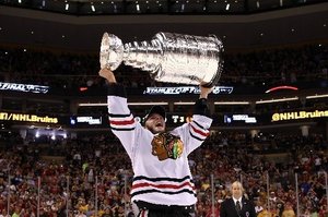 Jonathan Toews of the Chicago Blackhawks hoists the Stanley Cup Trophy after his team defeated the Boston Bruins in Game Six of the 2013 NHL Stanley Cup Final. Photo Getty Images