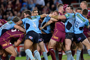 Queensland and New South Wales players fight during State of Origin II. Photo / Getty Images