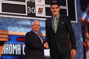 Steven Adams shakes the hand of outgoing NBA commissioner David Stern after being drafted by the Oklahoma City Thunder. Photo/AP