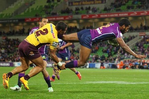 Sisa Waqa of the Storm is tackled by Josh Hoffman of the Broncos. Photo / Getty Images