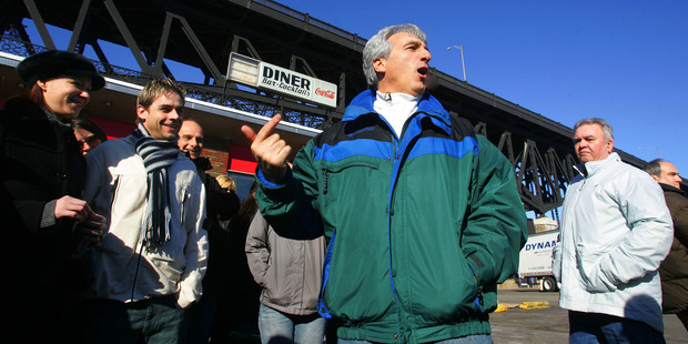 Tour guide Marc Baron (centre) describes a Sopranos scene filmed at an abandoned diner under the Pulaski Skyway bridge in Jersey City. Photo / AP