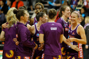The Firebirds celebrate after winning the semi-final. Photo / Christine Cornege