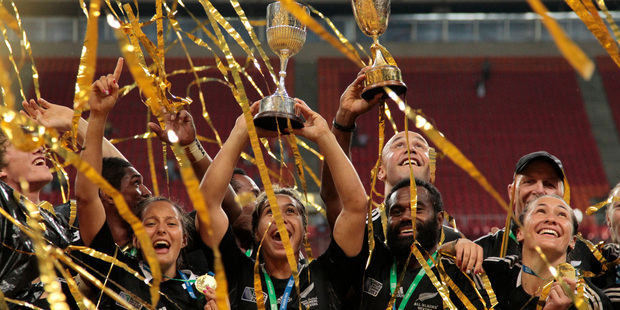 New Zealand's All Blacks teams celebrate with the men and women's trophies at the Rugby Sevens World Cup in Moscow, Russia. Photo / AP