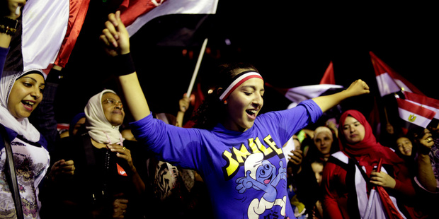 Opponents of Egypt's Islamist leader Mohammed Morsi celebrate outside the presidential palace in Cairo. Photo / AP