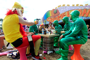 Colourful patrons enjoy the food offerings at Glastonbury.Photo / AP